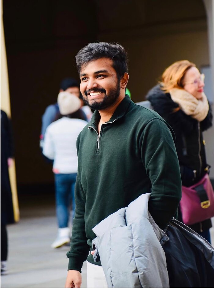 Amal Krishna smiling on a trip to Prague