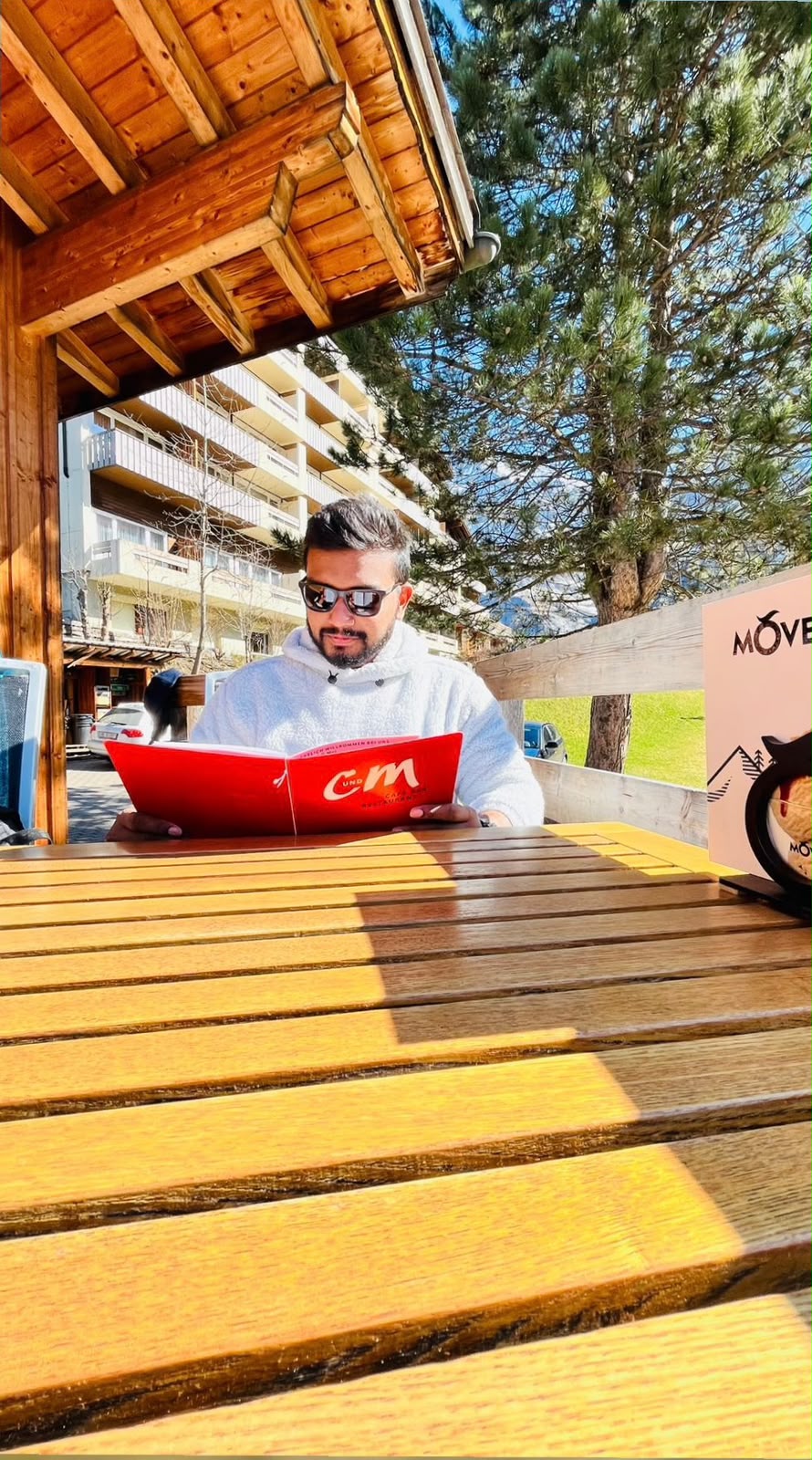 Amal reading while travelling